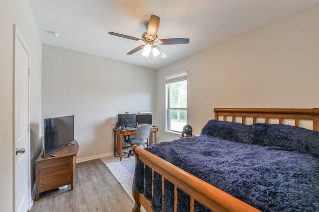 bedroom featuring ceiling fan and wood-type flooring