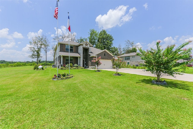 view of front of home featuring a front lawn and a garage