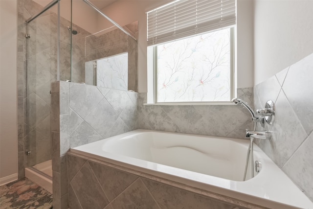 bathroom with shower with separate bathtub