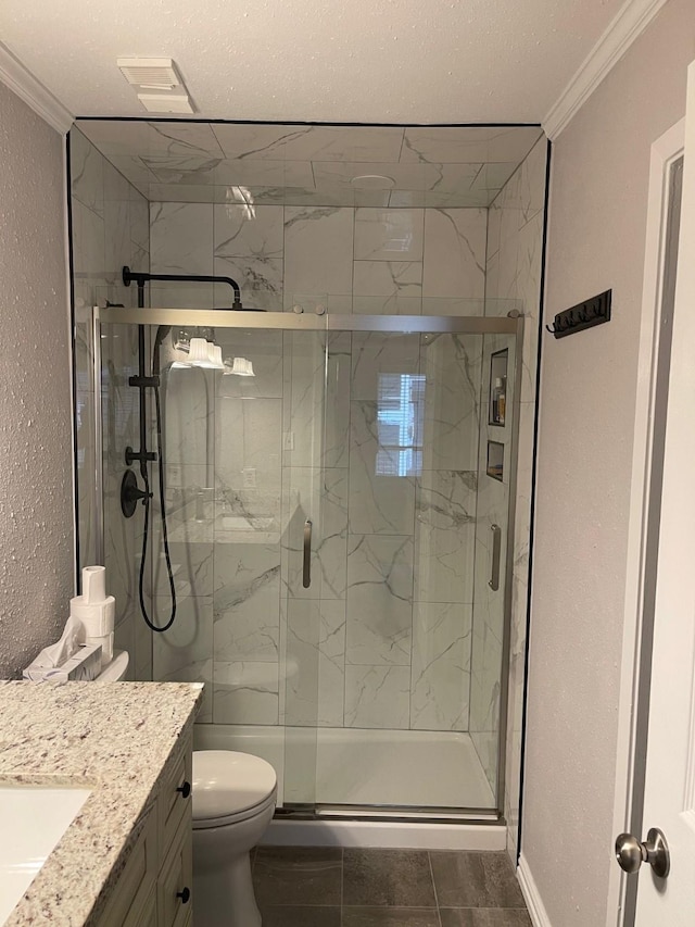 bathroom with crown molding, vanity, toilet, and walk in shower