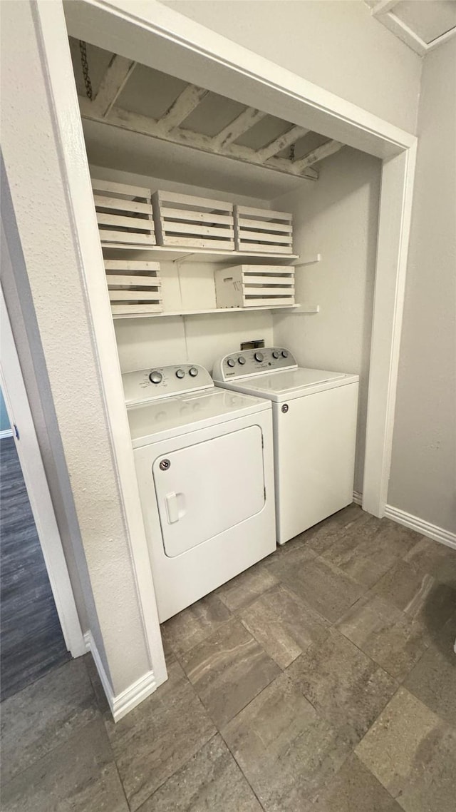 clothes washing area featuring separate washer and dryer