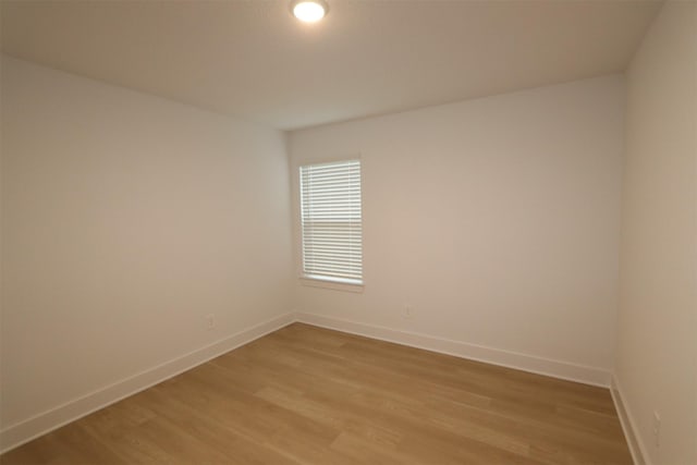 unfurnished room featuring light wood-type flooring