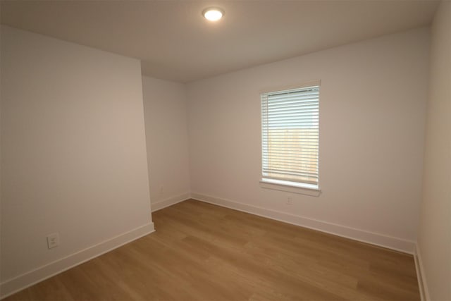 spare room with light wood-type flooring