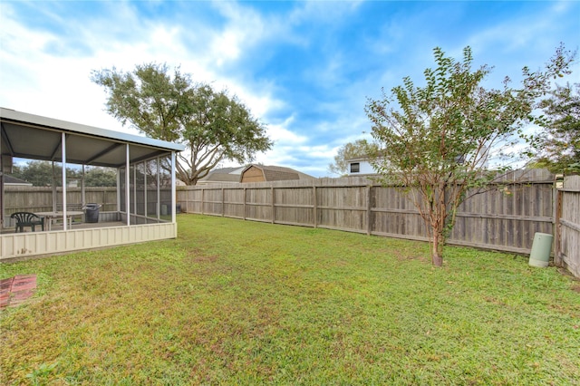 view of yard featuring a sunroom