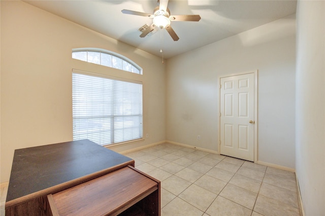 interior space with ceiling fan and light tile patterned floors