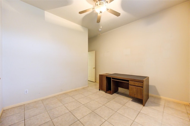 tiled empty room featuring ceiling fan