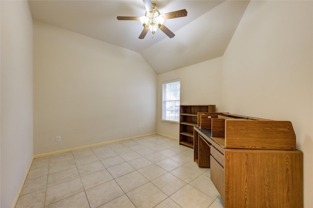 tiled empty room with ceiling fan and lofted ceiling