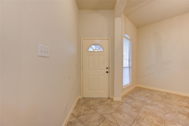 tiled foyer entrance featuring a healthy amount of sunlight