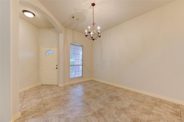 entryway featuring an inviting chandelier