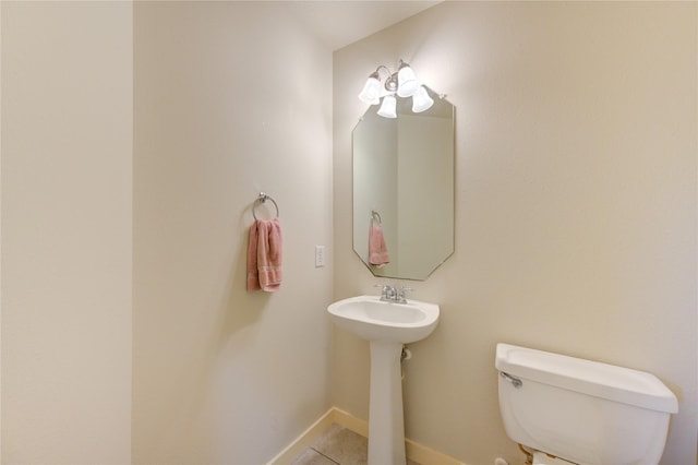 bathroom with tile patterned floors and toilet