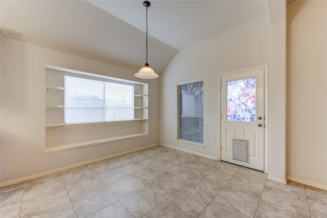 unfurnished dining area featuring light tile patterned flooring, built in features, and vaulted ceiling