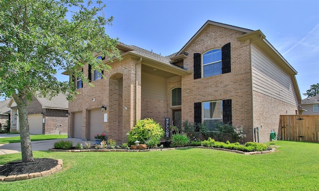 view of front of house with a garage and a front yard