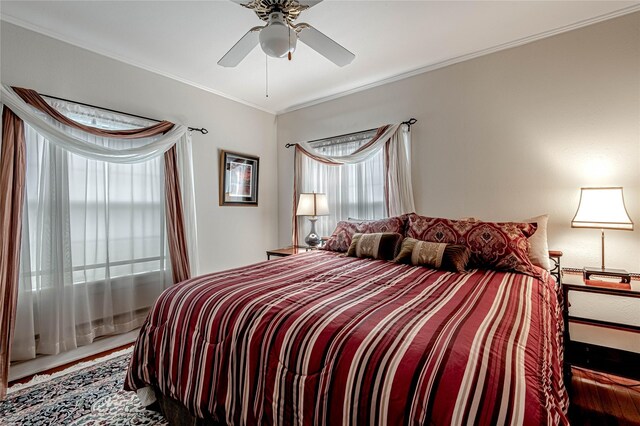 bedroom featuring ornamental molding and ceiling fan