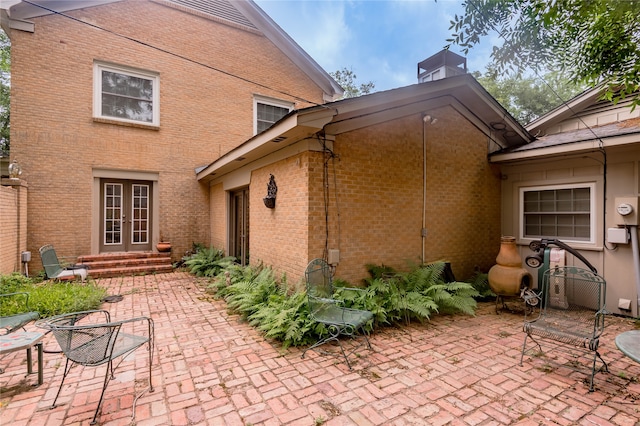 back of property featuring a patio area and french doors