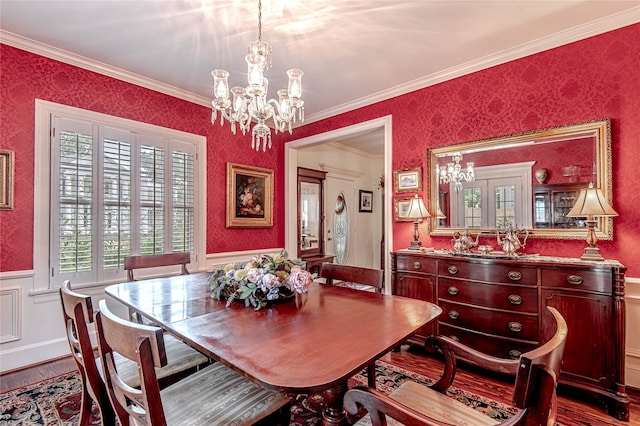 dining room featuring dark wood-type flooring, crown molding, and a chandelier