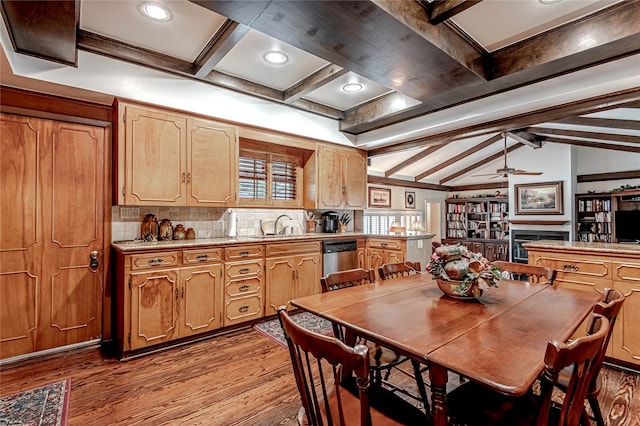 kitchen featuring tasteful backsplash, stainless steel dishwasher, ceiling fan, light hardwood / wood-style floors, and lofted ceiling with beams