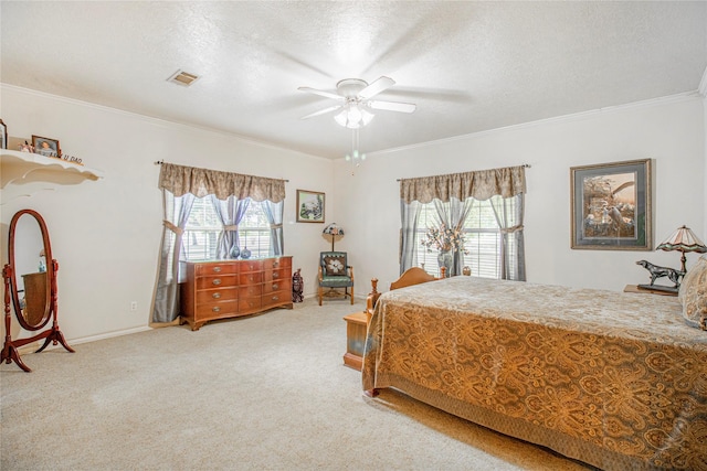 bedroom featuring ceiling fan, carpet flooring, ornamental molding, and a textured ceiling