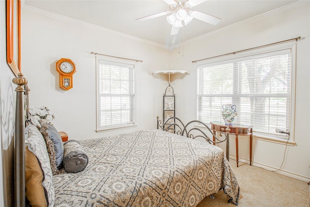 bedroom featuring crown molding, multiple windows, carpet floors, and ceiling fan