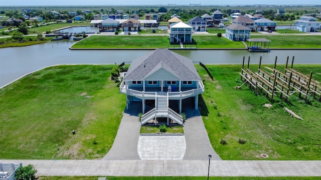 birds eye view of property with a water view