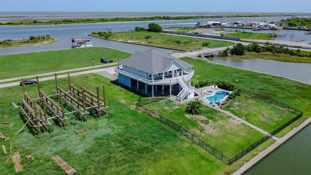 birds eye view of property with a water view