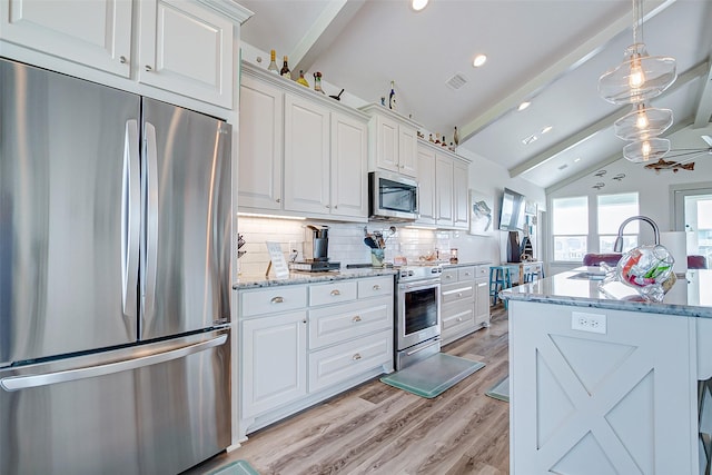 kitchen featuring white cabinetry, stainless steel appliances, decorative backsplash, light stone countertops, and lofted ceiling with beams