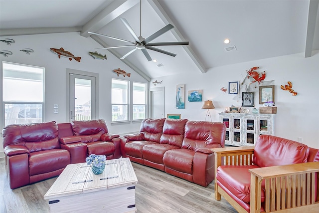 living room with light wood-type flooring and vaulted ceiling with beams