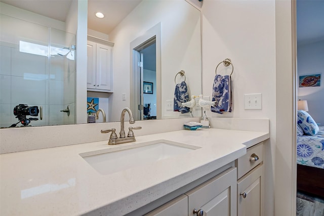 bathroom with vanity and hardwood / wood-style floors