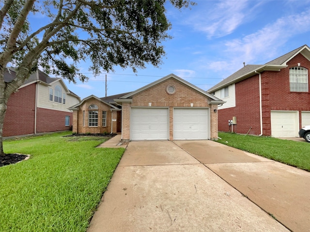 view of front of house featuring a garage and a front yard