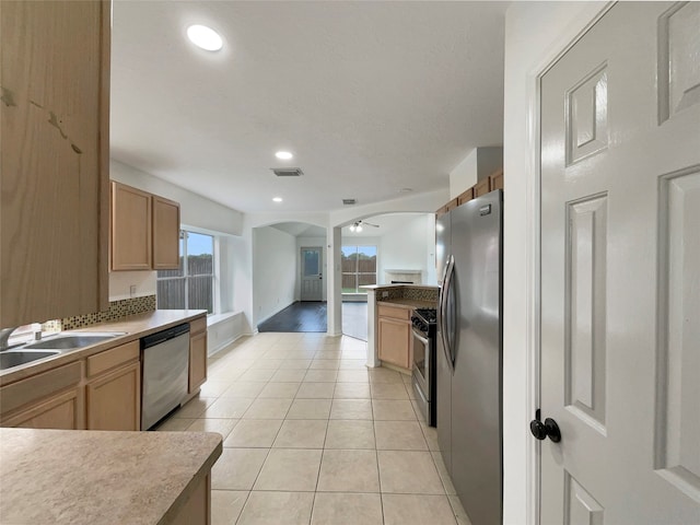 kitchen with sink, light hardwood / wood-style flooring, and stainless steel appliances