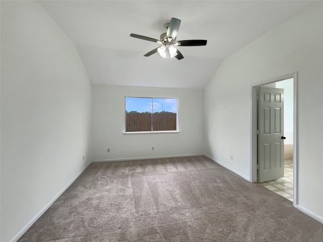 unfurnished room featuring carpet floors, ceiling fan, and vaulted ceiling