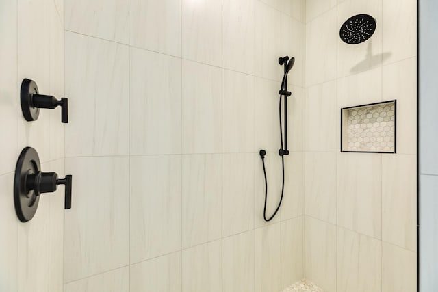 bathroom with a tile shower