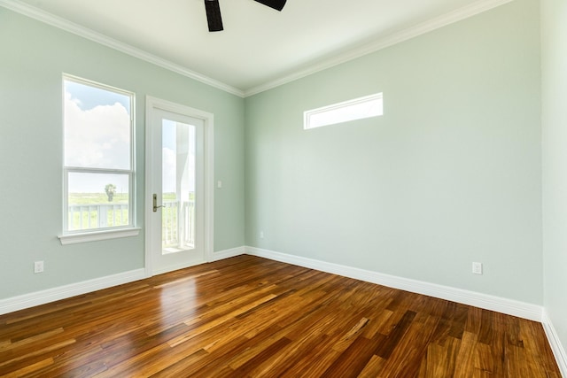 unfurnished room featuring ceiling fan, wood-type flooring, and ornamental molding