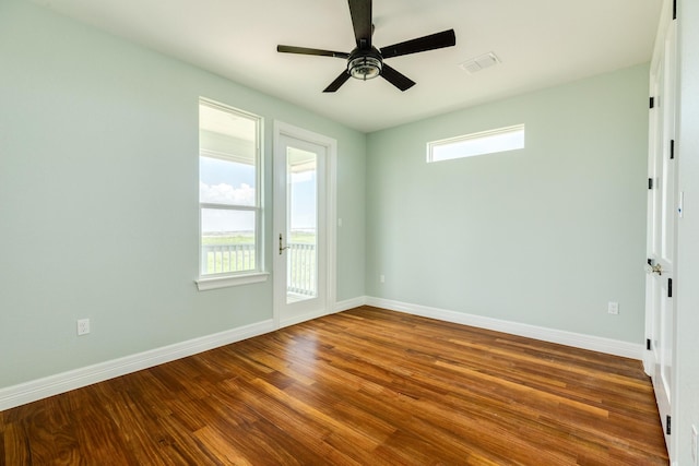 empty room with ceiling fan and wood-type flooring