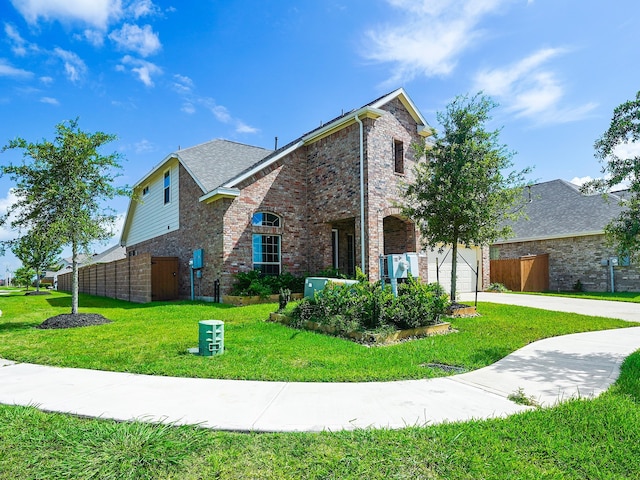 view of front facade featuring a garage and a front yard