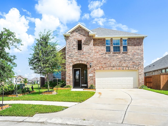 view of front of home with a garage and a front yard