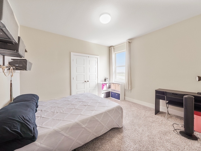 carpeted bedroom featuring a closet