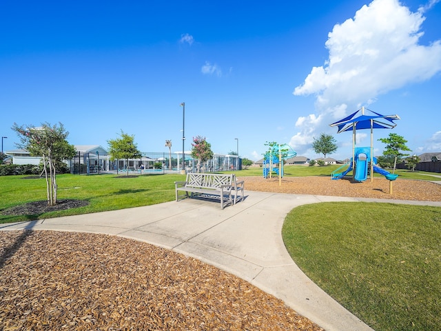 view of playground with a lawn