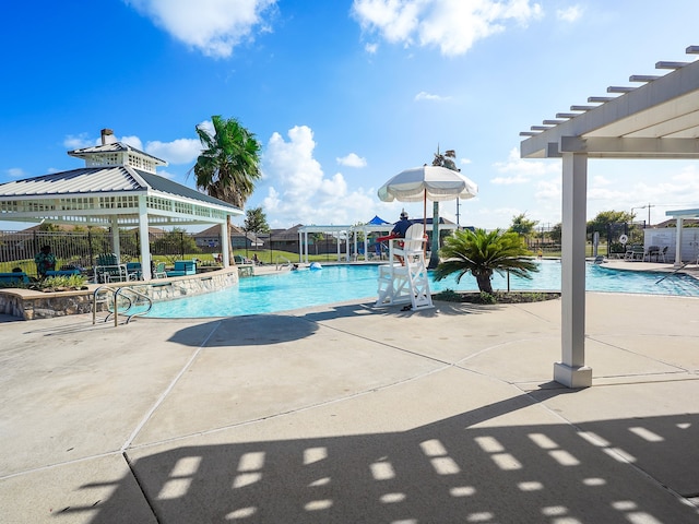 view of swimming pool with a patio