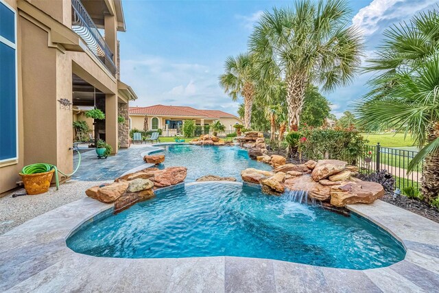 view of pool featuring a patio and pool water feature