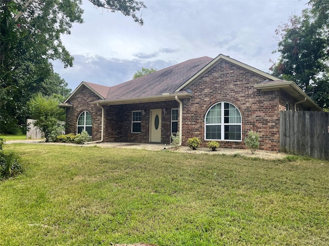 ranch-style house with a front yard