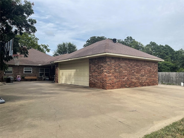 view of side of property with a garage