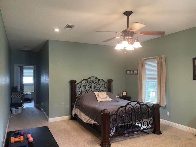 carpeted bedroom with ceiling fan