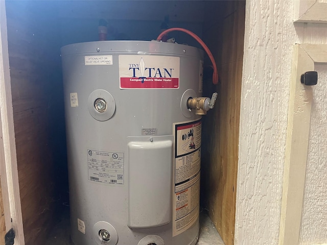 utility room featuring electric water heater