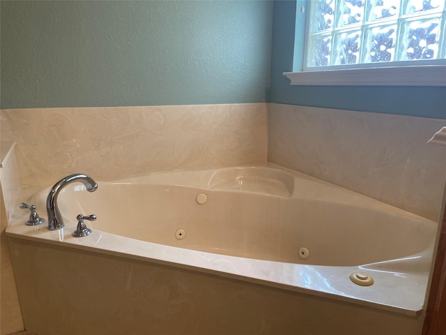 bathroom featuring a washtub