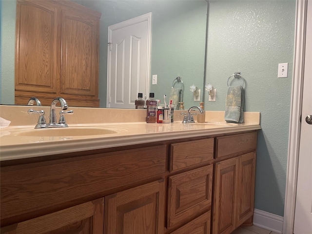 bathroom featuring tile patterned floors and vanity