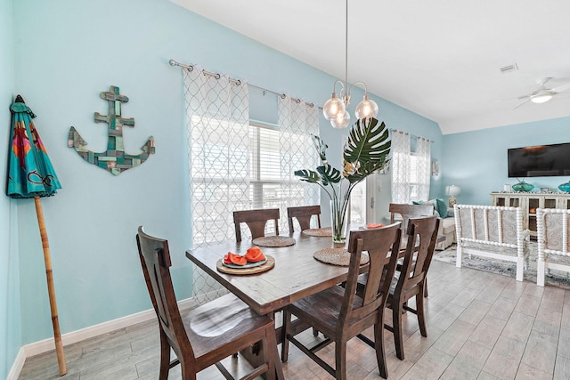 dining room featuring a wealth of natural light, light hardwood / wood-style floors, and ceiling fan