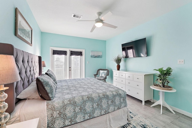 bedroom featuring ceiling fan, access to exterior, and light hardwood / wood-style floors