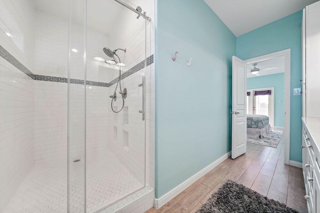 bathroom featuring a shower with door