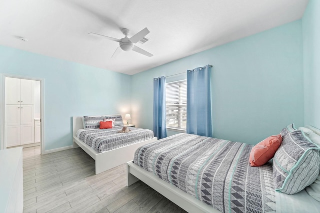 bedroom featuring ceiling fan and light wood-type flooring