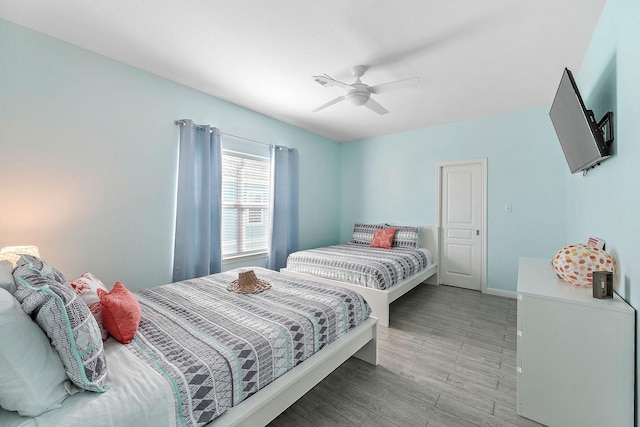 bedroom featuring ceiling fan and light hardwood / wood-style floors